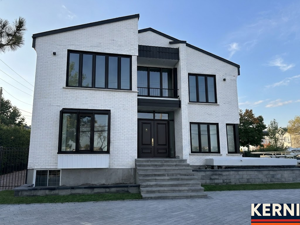 After: freshly spray painted, smooth exterior of an Edmonton home by KERNI PAINT