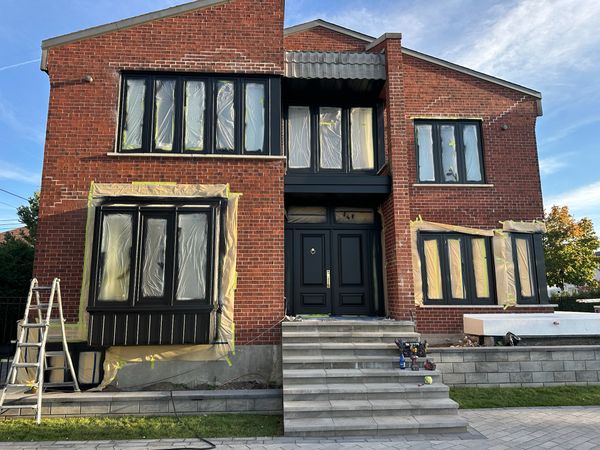 Professional spray painted home exterior in Alberta